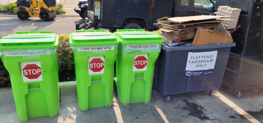 cardboard and food scrap recycling bins behind a restaurant in Fenton, MI